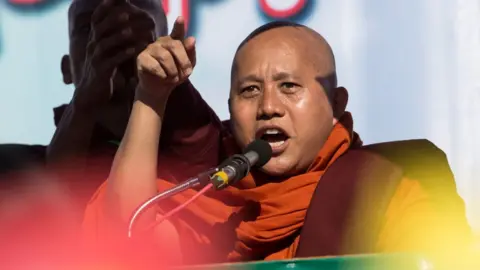 Getty Images Buddhist monk Wirathu delivers a speech during a rally to show the support to the Myanmar military in Yangon on October 14, 2018