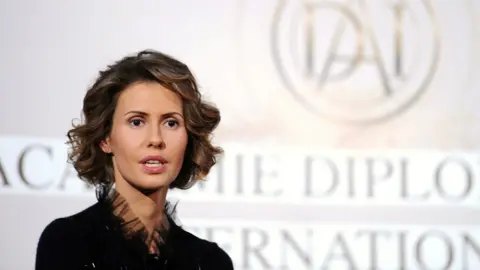 Getty Images Syrian president Bashar al-Assad's wife Asma speaks during a meeting at the International diplomatic academy in Paris, 10 December 2010