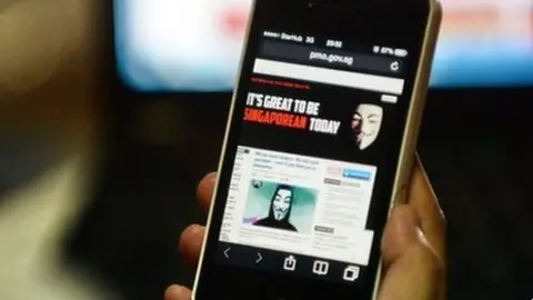 AFP A photo of the hacked website of Singapore Prime Minister circulated online