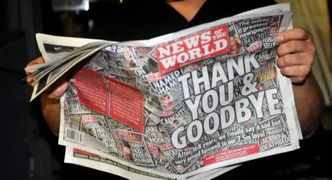 PA Media The final edition of the News of the World newspaper rolls off the press at the News International print works in Waltham Cross, Hertfordshire