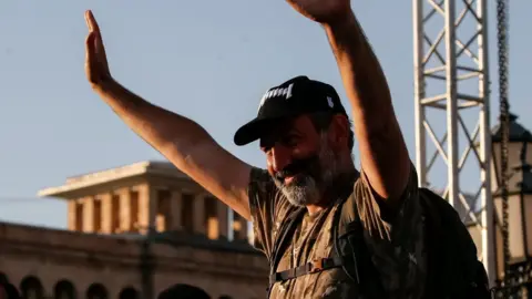 Reuters Armenian opposition leader Nikol Pashinyan waves to his supporters at a rally in Yerevan, Armenia May 2, 2018.