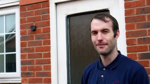 BBC Martin outside his house