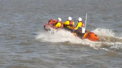 RNLI A three man lifeboat team were called to rescue a man from Sully Island on Wednesday