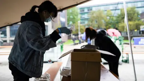 Getty Images Students prepare support boxes