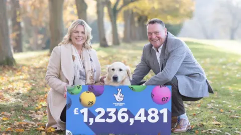 Camelot/PA Graham and Caroline Parris with their dog