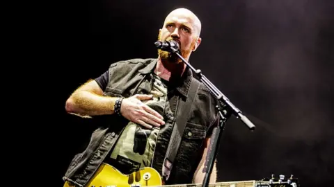 NurPhoto via Getty Images Mark Sheehan singing