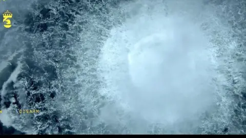 A screen grab from Danish Defense shows a gas leak causes bubbles on the surface of the water at Sea in Sweden on September 30, 2022