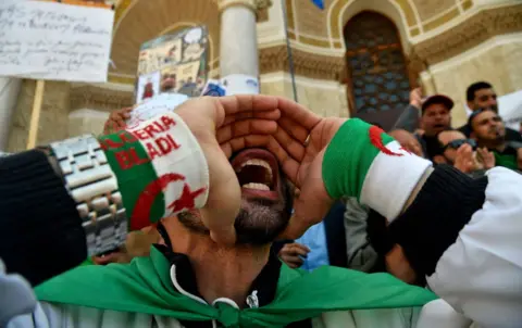 AFP Algerian protestors shout slogans during a demonstration marking May Day in Algiers on May 1, 2019.