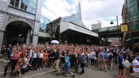 Stuart McKenna Hundreds of people gathered outside Borough Market for the re-opening