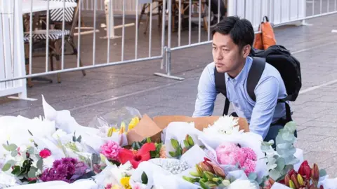 EPA A makeshift memorial to the victims of the Bondi Junction attack