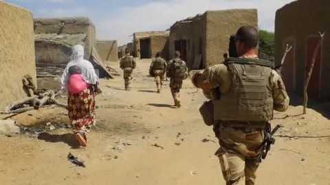 Getty Images Soldiers of France's Barkhane mission patrol in In-Tillit in 2017 in Mali