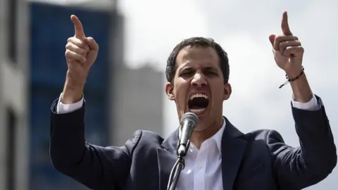 Getty Images Venezuela"s National Assembly head Juan Guaido speaks to the crowd during a mass opposition rally