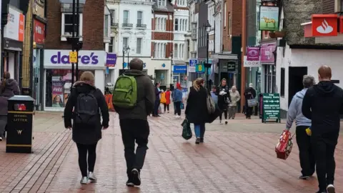 One of Wrexham's main shopping streets busy with shoppers