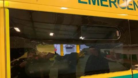 West Midlands Ambulance Service Damage to the window after ambulance attacked