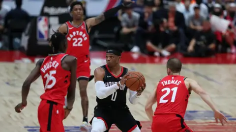 Getty Images The Houston Rockets playing the Toronto Raptors in Japan on Tuesday