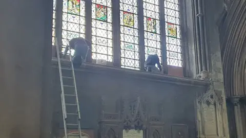 Bristol Cathedral Workers covering up the Colston name
