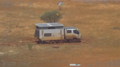 Reuters The bogged campervan in the desert