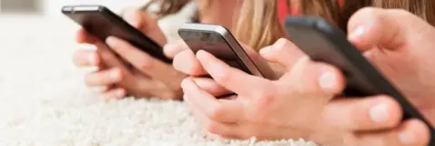 Getty Images Girls with phones