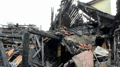 Steve Hubbard/BBC The Chequers pub after a fire