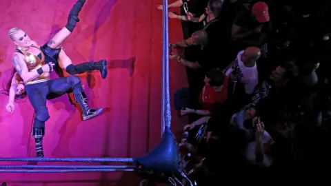 Wrestlers perform at an all female wrestling event in London
