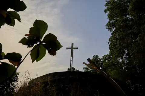 Hugh Kinsella Cunningham Cross on a hill in Waterloo district, Sierra Leone.