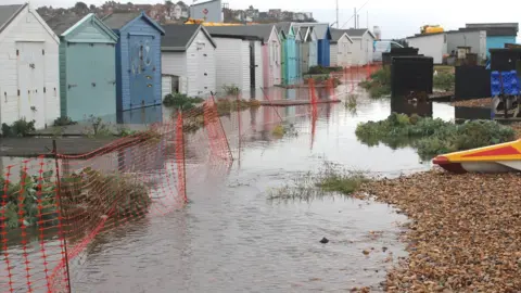 Kevin Boorman Flooded beach huts at Bulverhythe