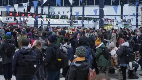 Eddie Mitchell Passengers waiting at Brighton Station