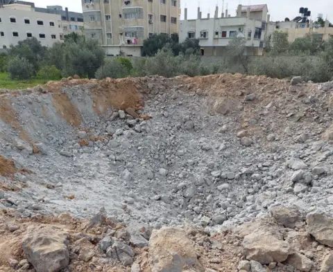 Dr Ahmed Abuibaid A crater caused by an air strike in Rafah