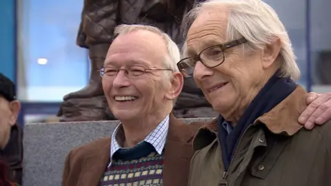 Brian Punter-Mathews Dai Bradley and Ken Loach with statue in Barnsley