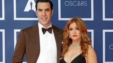 Getty Images Sacha Baron Cohen and Isla Fisher