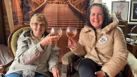 BBC Two women holding wine glasses