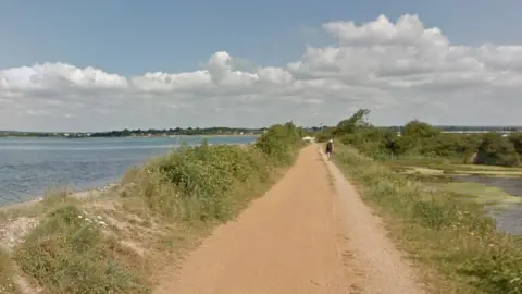Google The Hayling Island Billy Trail dirt track with water on both sides