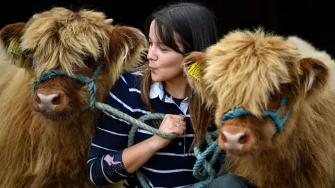 Jeff J Mitchell/Getty Images Louise Fotheringham, from France Farm at Gartocharn, with Pinky and Perky
