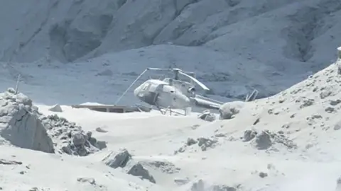 Michael Schade Helicopter covered in ash on White Island, 9 December