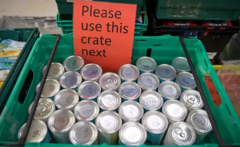 Finnbarr Webster/Getty Images Food bank sorting hub - generic image