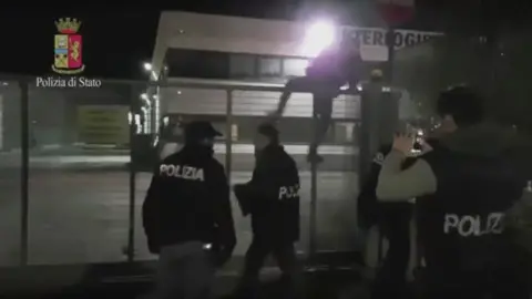 Italian police Screen grab of video shows Italian police entereing a depot