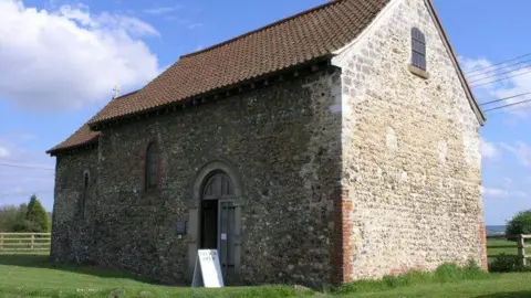 Hywel Williams/St Benedict's Church A small grey stone church