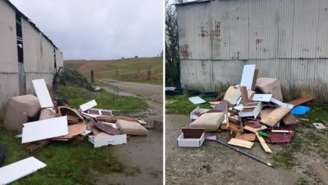 Two side by side images showing different angles of a pile of waste - including broken up wood from a white chest of drawers, an armchair, a swab for the armchair, and a broom - which has been dumped beside a dilapidated corrugated metal barn in the Wiltshire countryside, next to a track. It is a cloudy day.