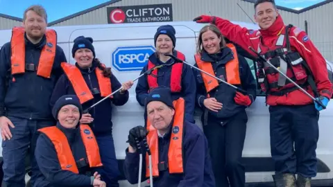 RSPCA Volunteer litter pickers posing in a group