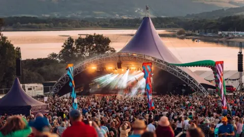 Valley fest stage with Chew Valley Lake in background