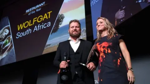 AFP Chef Kobus van der Merwe receives his award during the inaugural World Restaurant Awards on 18 February 2019 in Paris