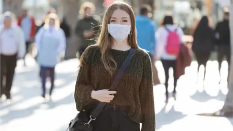 Getty Images woman wearing a face mask