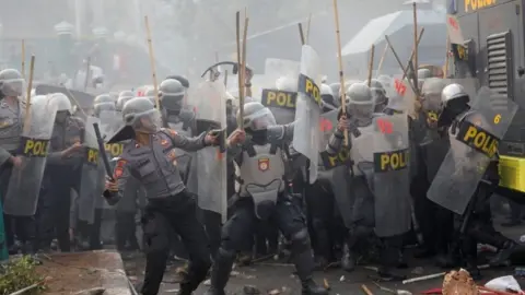 Reuters Police are seen during clashes outside parliament in Jakarta