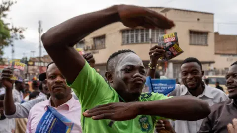 Getty Images Supporters of President Felix Tshisekedi celebrate victory in front of the UDPS (Union for Democracy and Social Progress) party headquarters in Lubumbashi, on December 31, 2023