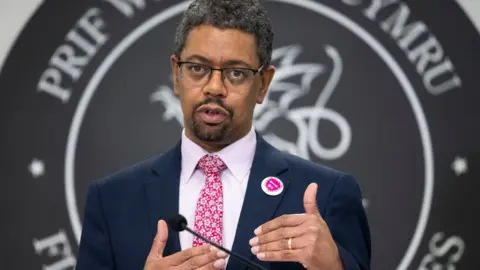Getty Images Vaughan Gething hosting a Welsh government news conference