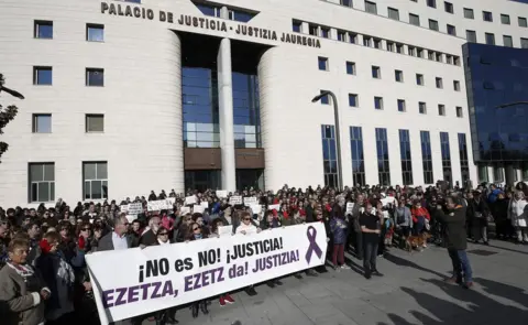 EPA Protesters show a banner that reads "No is no. Justice!" during a protest held at the Superior Court of Navarra