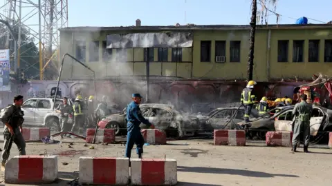 Reuters Afghan police inspect the site of a blast in Jalalabad, Afghanistan, July 1, 2018