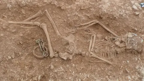 University of Sheffield Skeleton of a woman buried in the ground with jewellery
