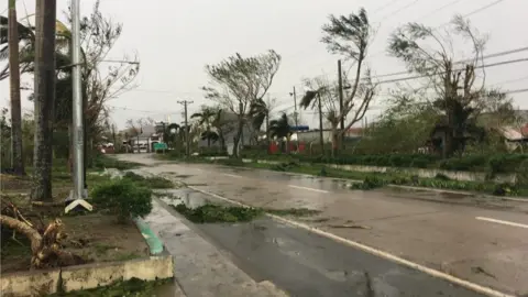 Luke Lasam Storm damage and flooded road in Tuguegarao