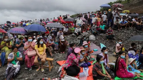 BBC Prayers at a mass ceremony for the dead and missing held in July